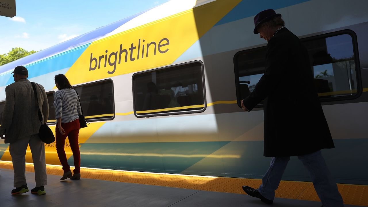 Passengers load up on the Brightline train at the Fort Lauderdale station during the inaugural trip from Miami to West Palm Beach in May 2018.