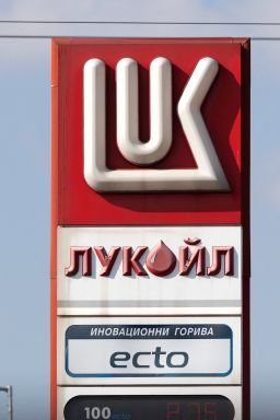 A woman walks near a Lukoil gas station in Sofia, Bulgaria, on October 23, 2025.