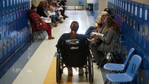 Patients line up to receive treatment at a pop-up Remote Area Medical health clinic in Eidson, Tennessee, on October 25, 2025.