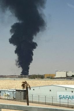A large plume of black smoke rises from the fuel storage area at King Khalid International Airport, in Riyadh, Saudi Arabia on Saturday.