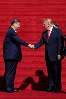 US President Donald Trump and Chinese President Xi Jinping shake hands alongside US first lady Melania Trump and Chinese President Xi Jinping's wife Peng Liyuan, after visiting the National Archives Museum in Washington, DC, September 25