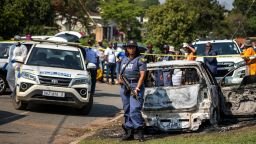 A police officer stands at the scene of a mass shooting at a house party in KwaMakhutha township south of the city of Durban, South Africa, onSeptember 23, 2026.