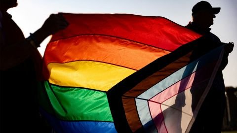People participate in an event to raise Bucks County's Pride Flag to kick off Pride Month in Doylestown, Pennsylvania, in June 2023.