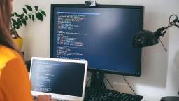 A programmer works at home in their office.