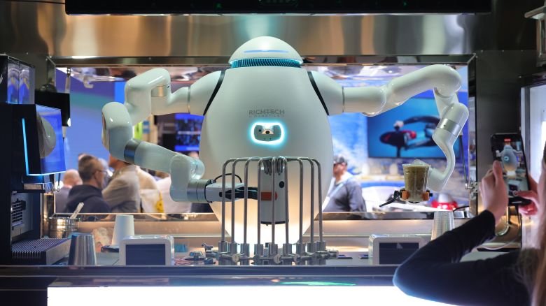 ADAM, an interactive robot bartender, barista and chef, makes drinks for attendees at the Richtech Robotics booth during CES 2024 at the Las Vegas Convention Center on January 10, 2024 in Las Vegas, Nevada.
