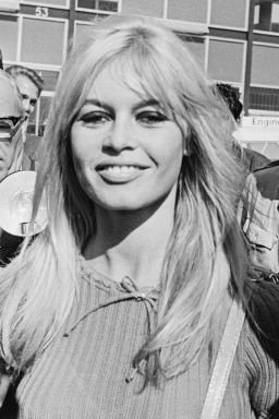 French actress Brigitte Bardot surrounded by photographers after arriving at London Airport (now Heathrow) in September 1966. (Photo by Len Trievnor/Daily Express/Hulton Archive/Getty Images)