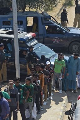 Spectators queue to enter the National Stadium in Karachi, Pakaistan on February 19, 2025, ahead of the ICC Champions Trophy one-day international cricket match between Pakistan and New Zealand.