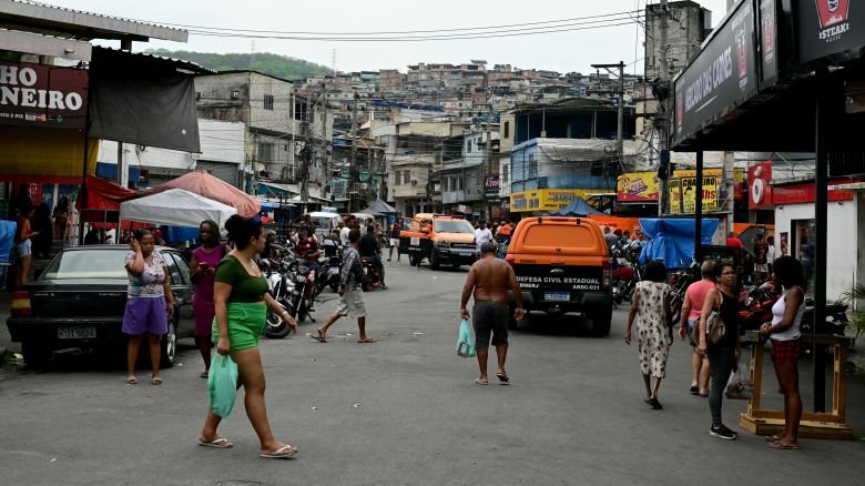 Civil Defense vehicles are seen on a street in the Vila Cruzeiro favela at the Penha complex in Rio de Janeiro, Brazil, on October 29, 2025, in the aftermath of Operacao Contencao (Operation Containment). Residents of a favela in Rio de Janeiro lined up more than 50 bodies at a plaza in their low-income neighborhood on Ocotber 29, a day after the bloodiest police operation in the city's history, AFP reported. (Photo by Pablo PORCIUNCULA / AFP) (Photo by PABLO PORCIUNCULA/AFP via Getty Images)