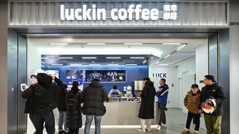 Costumers are seen at a branch of Chinese coffeehouse chain 'Luckin' as they visit a new shopping mall at the Tongzhou district of Beijing on December 26, 2025. (Photo by ADEK BERRY / AFP via Getty Images)