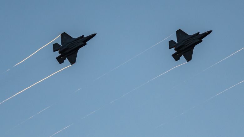 F-35s fly in formation with their afterburners during a kick-off celebration for the "Great American State Fair" on the National Mall in Washington, DC, on June 24.