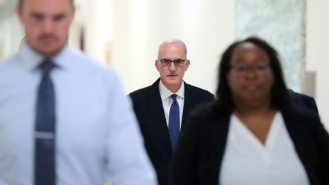 Doug Band, center, a former aide to Bill Clinton, arrives to testify at a closed-door interview with the House Oversight Committee on Capitol Hill on June 30, 2026 in Washington, DC.