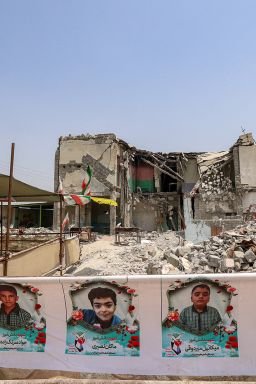 The building of the destroyed Shajareh Tayebeh elementary school, surrounded by rubble in Minab, Iran, on August 10, 2026.