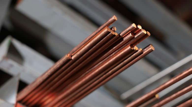 Copper rods sit on the shelf of C & R Metals on August 7, 2026, in Miami. Copper has hit record highs this week.