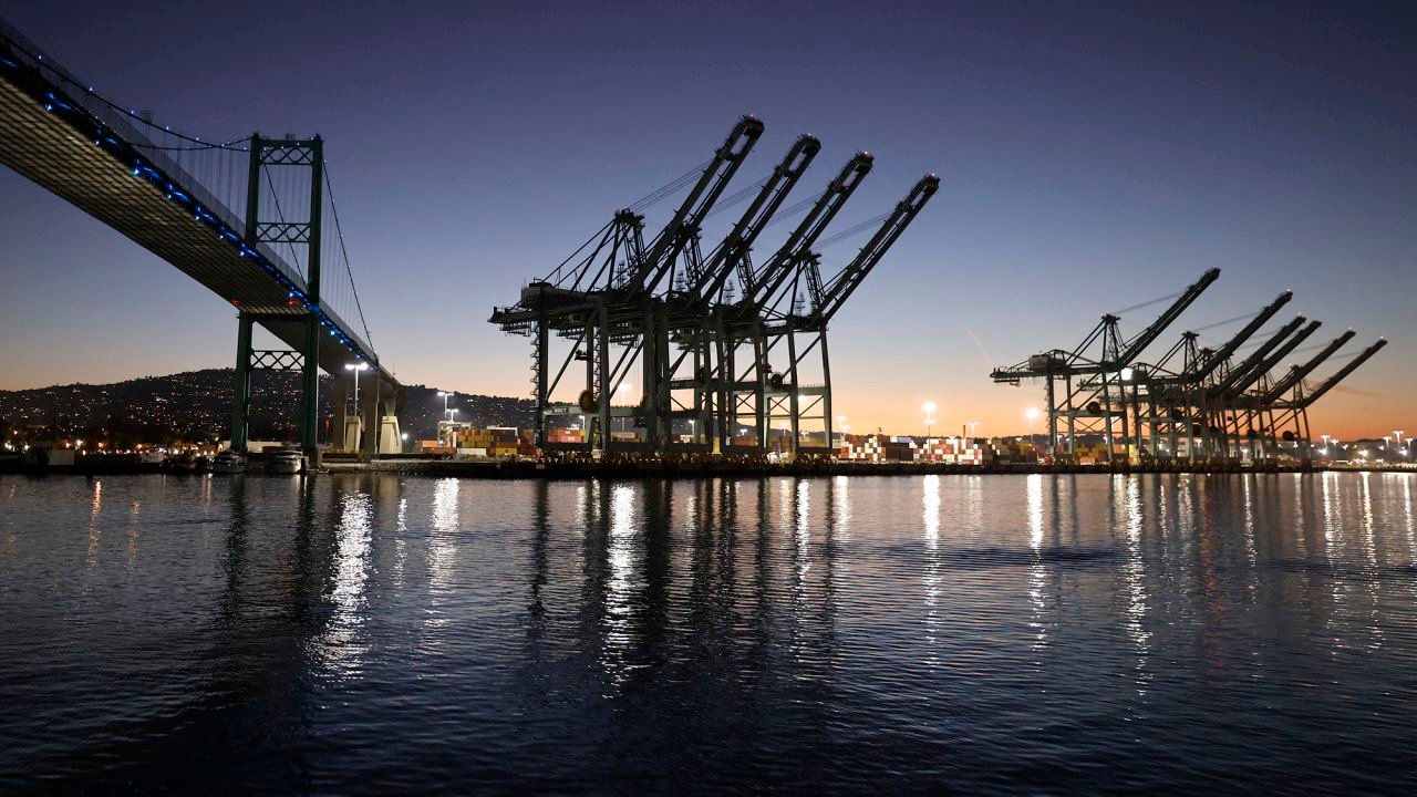 Shipping cranes stand near the Vincent Thomas Bridge at the Port of Los Angeles on August 19, 2026 in Los Angeles, California.