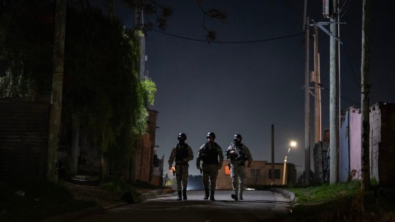 Members of Uruguay's Special Operations Group (GEO) leave the scene of a shooting in the Marconi neighbourhood of Montevideo on August 19, 2026.