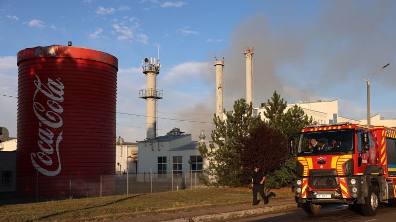 Ukrainian rescuers work at a Coca-Cola factory hit by a Russian strike in the Kyiv region on September 3, 2026, amid the Russian invasion of Ukraine.