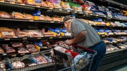 A shopper searches for meat products at a supermarket in Colebrook, New Hampshire, on September 13.