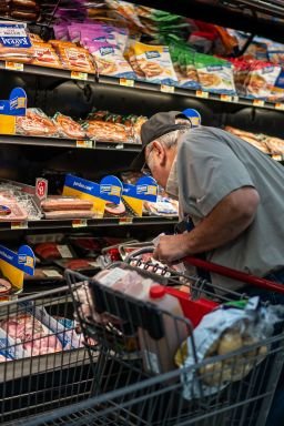 A shopper searches for meat products at a supermarket in Colebrook, New Hampshire, on September 13.