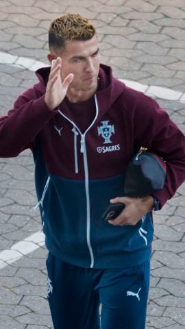 Portugal's forward #07 Cristiano Ronaldo (L) and Portugal's defender #02 Diogo Dalot arrive for a training session at Parken stadium in Copenhagen, Denmark, on September 30, 2026, on the eve of their Nations League Group A4 match against Denmark. (Photo by Liselotte Sabroe / Ritzau Scanpix / AFP via Getty Images) / Denmark OUT