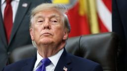 President Donald Trump listens to a reporter's question in the Oval Office at the White House on September 28.