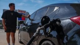 A man fuels a vehicle at a gas station in Alexandria, Virginia, on October 02, 2026. The U.S. national average for regular gasoline stood at about $4.40 per gallon on October 2, according to AAA, after September recorded its highest monthly average on record at $4.33 per gallon.