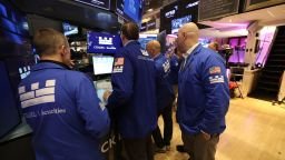 Traders work on the floor of the New York Stock Exchange at the opening bell in New York on Monday.