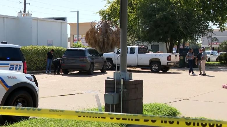 Investigators work the scene where an unmarked ICE vehicle struck a man described as an undocumented immigrant from Mexico on Saturday.